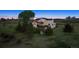 Expansive backyard of a two-story house, featuring a wooden deck, fenced yard, and play structure at 7289 Stroh Rd, Parker, CO 80134