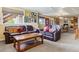 Spacious basement featuring comfortable sofas, a coffee table, and a pool table for entertainment at 7289 Stroh Rd, Parker, CO 80134