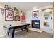 Finished basement features an air hockey table and cozy fireplace, perfect for entertaining and relaxing at 7289 Stroh Rd, Parker, CO 80134