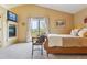 Bedroom featuring a fireplace, balcony access and vaulted ceilings at 7289 Stroh Rd, Parker, CO 80134