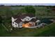 Stunning two-story home featuring a large front yard and an inviting outdoor seating area at 7289 Stroh Rd, Parker, CO 80134