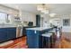 Stylish kitchen featuring a large island with seating, stainless steel appliances, and modern finishes at 7289 Stroh Rd, Parker, CO 80134
