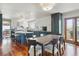 Open concept kitchen with dining area featuring stainless appliances and adjacent outdoor deck access at 7289 Stroh Rd, Parker, CO 80134