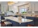 Contemporary kitchen boasting stainless steel appliances, custom cabinets, and a spacious island at 7289 Stroh Rd, Parker, CO 80134