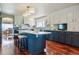 Modern kitchen with an island, stainless steel appliances, custom cabinets and eat-in breakfast area at 7289 Stroh Rd, Parker, CO 80134