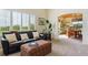 Cozy living room with plush seating leading to a dining area bathed in natural light at 7289 Stroh Rd, Parker, CO 80134