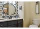 Stylish powder room featuring unique tile work and modern fixtures at 7289 Stroh Rd, Parker, CO 80134
