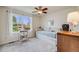 Cozy bedroom with a daybed, large window, and neutral color scheme creating a relaxing space at 9032 W Arizona Dr, Lakewood, CO 80232