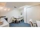 Bright dining area with a white table and chairs, complemented by natural light at 9032 W Arizona Dr, Lakewood, CO 80232