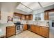 Spacious kitchen with modern stainless steel appliances, wood cabinets, and ample counter space at 9032 W Arizona Dr, Lakewood, CO 80232