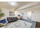 Inviting living room with a futon, accent rug, and an open layout perfect for relaxation and entertaining at 9032 W Arizona Dr, Lakewood, CO 80232