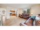 Living room with hardwood floors that transitions to open-concept kitchen at 9032 W Arizona Dr, Lakewood, CO 80232