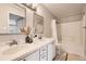 Bathroom featuring double sinks, ample counter space, and a shower-tub combination at 8358 Pebble Creek Way # 204, Highlands Ranch, CO 80126