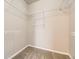Walk-in closet features carpet flooring and wire shelving for optimal organization at 8358 Pebble Creek Way # 204, Highlands Ranch, CO 80126