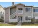 Inviting townhome with gray siding, private entrance, and well-maintained landscaping at 8358 Pebble Creek Way # 204, Highlands Ranch, CO 80126
