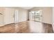 Bright living room with hardwood floors and a sliding glass door leading to the outside patio at 8358 Pebble Creek Way # 204, Highlands Ranch, CO 80126