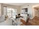 Bright living room featuring a sliding glass door to a balcony and modern decor at 8358 Pebble Creek Way # 204, Highlands Ranch, CO 80126