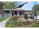 Inviting backyard with a cozy covered patio, garden area, and ample seating for outdoor enjoyment at 110 S Hoyt St, Lakewood, CO 80226