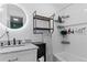 Modern bathroom with a stylish vanity, sleek fixtures, and a well-lit mirror at 110 S Hoyt St, Lakewood, CO 80226