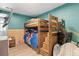 Cozy bedroom with wood bunkbeds, playful decor, and ample space for  at 110 S Hoyt St, Lakewood, CO 80226