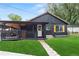Charming, renovated home with a manicured lawn and covered deck for outdoor relaxation at 110 S Hoyt St, Lakewood, CO 80226