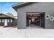 Spacious garage with a modern gym setup and an additional door for backyard access at 110 S Hoyt St, Lakewood, CO 80226