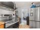 Cozy kitchen with stainless steel appliances and easy access to the rest of the home at 110 S Hoyt St, Lakewood, CO 80226
