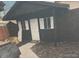 Exterior of storage shed featuring neutral siding, with white trimmed windows and door at 110 S Hoyt St, Lakewood, CO 80226