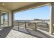 Balcony area with deck overlooks a view of snow and rolling hills at 3856 Treadway Pt, Castle Rock, CO 80108