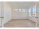 Bright and airy bedroom featuring large windows providing natural light at 3856 Treadway Pt, Castle Rock, CO 80108