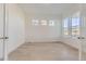 Bedroom featuring light hardwood floors, recessed lighting, and three horizontal windows for natural light at 3856 Treadway Pt, Castle Rock, CO 80108