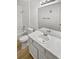 Bathroom with white vanity, single sink, and shower/tub combo at 4450 S Pitkin St # 128, Aurora, CO 80015