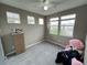 Second bedroom with plush rug and large windows at 23080 York Ave, Parker, CO 80138