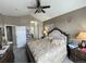 Primary bedroom with king-size bed and ensuite access at 23080 York Ave, Parker, CO 80138