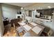 Open concept dining room with hardwood floors and adjacent kitchen at 23080 York Ave, Parker, CO 80138