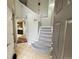 Bright and spacious entryway with staircase and view of kitchen at 23080 York Ave, Parker, CO 80138