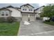 Two-story home with two-car garage and landscaped front yard at 23080 York Ave, Parker, CO 80138