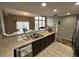 Open kitchen with breakfast bar overlooking the living room at 23080 York Ave, Parker, CO 80138