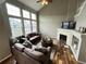 Living room with fireplace, hardwood floors, and large windows at 23080 York Ave, Parker, CO 80138