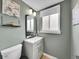 Well-lit bathroom with a modern vanity, clean lines, and a soft color scheme at 6720 S Adams Way, Centennial, CO 80122