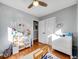 Bright bedroom featuring hardwood floors, ceiling fan, and natural light at 6720 S Adams Way, Centennial, CO 80122