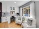 Bright dining area features built-in cabinets, a desk, and comfortable seating at 6720 S Adams Way, Centennial, CO 80122