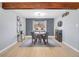 Elegant dining area featuring a stylish light fixture, sleek wine rack, and a neutral color palette at 6720 S Adams Way, Centennial, CO 80122