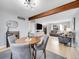 Open floor plan blending living and dining areas, complemented by modern lighting and neutral furnishings at 6720 S Adams Way, Centennial, CO 80122