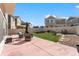 Spacious backyard featuring a patio, artificial grass, and rock landscaping at 18284 E 52Nd Pl, Denver, CO 80249