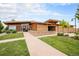Modern community clubhouse featuring stone accents, wood siding, and professionally landscaped grounds at 1027 Auburn Dr, Erie, CO 80516