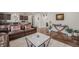 Open-concept living room with hardwood floors and plenty of natural light at 1027 Auburn Dr, Erie, CO 80516