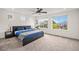 Spacious main bedroom with natural light, plush carpet, and soothing decor at 1027 Auburn Dr, Erie, CO 80516