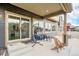 Cozy patio with a hanging chair and lounge seating perfect for relaxing outdoors at 1027 Auburn Dr, Erie, CO 80516
