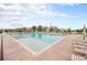 Community pool featuring a lap lane, recreational swimming area and ample lounge chairs at 1027 Auburn Dr, Erie, CO 80516